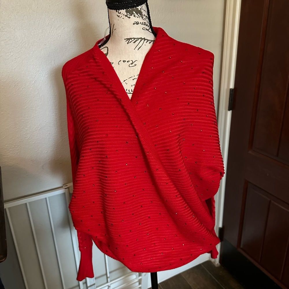 Beautiful crossover top by Questions. Perfect for all your holiday parties!